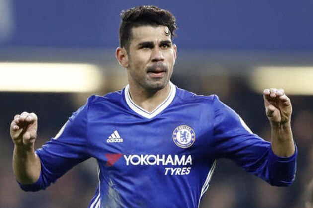 Chelsea's Diego Costa celebrates with teammates after scoring during the English Premier League soccer match between Chelsea and Hull City at Stamford Bridge stadium in London, Sunday, Jan. 22, 2017. (AP Photo/Frank Augstein)