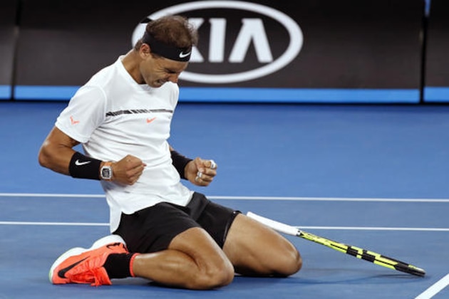 Spain's Rafael Nadal celebrates after defeating Canada's Milos Raonic during their quarterfinal at the Australian Open tennis championships in Melbourne, Australia, Wednesday, Jan. 25, 2017. (AP Photo/Kin Cheung)