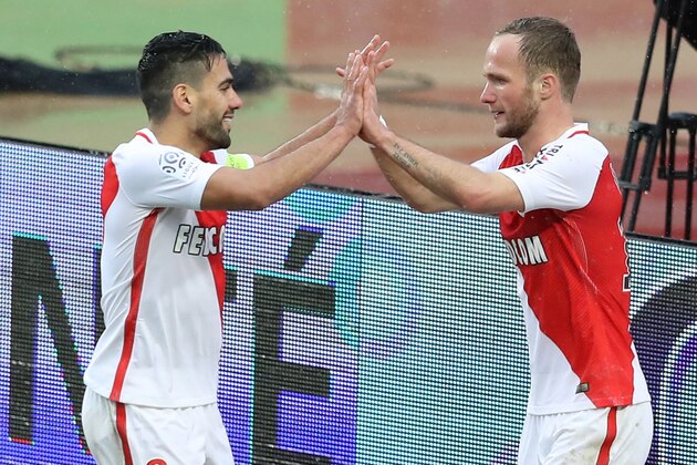 Monaco's French forward Valere Germain (R) celebrates with Monaco's Colombian forward Radamel Falcao (L) after scoring a goal during the French L1 football match between Monaco (ASM) and Lorient (FCL) on January 22, 2017 at the 'Louis II Stadium' in Monaco. / AFP / VALERY HACHE        (Photo credit should read VALERY HACHE/AFP/Getty Images)