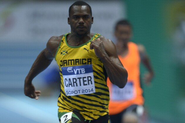 Jamaica's Nesta Carter compete  in men 60 meter heat 4 at the IAAF World Indoor Athletics Championships in the Ergo Arena in the Polish coastal town of Sopot, on March 7, 2014.     AFP PHOTO / JOHANNES EISELE        (Photo credit should read JOHANNES EISELE/AFP/Getty Images)
