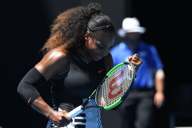Serena Williams of the US celebrates her victory against Britain's Johanna Konta in their women's singles quarter-final match on day ten of the Australian Open tennis tournament in Melbourne on January 25, 2017. / AFP / SAEED KHAN / IMAGE RESTRICTED TO EDITORIAL USE - STRICTLY NO COMMERCIAL USE        (Photo credit should read SAEED KHAN/AFP/Getty Images)
