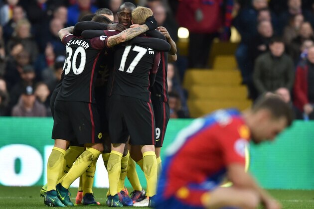 Manchester City's Ivorian midfielder Yaya Toure (C) celebrates with teammates after scoring the opening goal during the English Premier League football match between Crystal Palace and Manchester City at Selhurst Park in south London on November 19, 2016. / AFP / OLLY GREENWOOD / RESTRICTED TO EDITORIAL USE. No use with unauthorized audio, video, data, fixture lists, club/league logos or 'live' services. Online in-match use limited to 75 images, no video emulation. No use in betting, games or single club/league/player publications. / (Photo credit should read OLLY GREENWOOD/AFP/Getty Images) Manchester City's Ivorian midfielder Yaya Toure (C) celebrates with teammates after scoring the opening goal during the English Premier League football match between Crystal Palace and Manchester City at Selhurst Park in south London on November 19, 2016. / AFP / OLLY GREENWOOD / RESTRICTED TO EDITORIAL USE. No use with unauthorized audio, video, data, fixture lists, club/league logos or 'live' services. Online in-match use limited to 75 images, no video emulation. No use in betting, games or single club/league/player publications. / (Photo credit should read OLLY GREENWOOD/AFP/Getty Images)