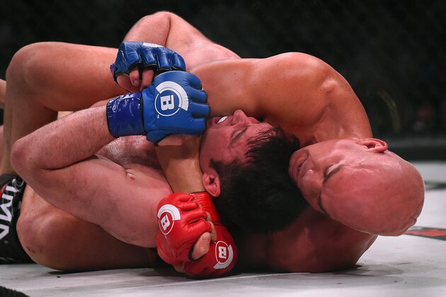 INGLEWOOD, CA - JANUARY 21: Chael Sonnen (blue gloves) taps out giving Tito Ortiz (red gloves) the victory in round one of his Bellator MMA light heavyweight fight at The Forum on January 21, 2017 in Inglewood, California. (Photo by Jayne Kamin-Oncea/Getty Images)
