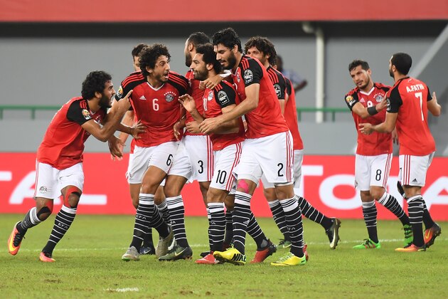 Egypt's forward Mohamed Salah (C) celebrates with teammates after scoring a goal during the 2017 Africa Cup of Nations group D football match between Egypt and Ghana in Port-Gentil on January 25, 2017. / AFP / Justin TALLIS (Photo credit should read JUSTIN TALLIS/AFP/Getty Images) Egypt's forward Mohamed Salah (C) celebrates with teammates after scoring a goal during the 2017 Africa Cup of Nations group D football match between Egypt and Ghana in Port-Gentil on January 25, 2017. / AFP / Justin TALLIS (Photo credit should read JUSTIN TALLIS/AFP/Getty Images)