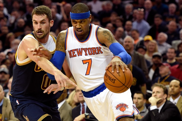 CLEVELAND, OH - OCTOBER 30: Carmelo Anthony #7 of the New York Knicks handles the ball against Kevin Love #0 of the Cleveland Cavaliers in the first quarter at Quicken Loans Arena on October 30, 2014 in Cleveland, Ohio. NOTE TO USER: User expressly acknowledges and agrees that, by downloading and or using this photograph, User is consenting to the terms and conditions of the Getty Images License Agreement.  (Photo by Jason Miller/Getty Images)