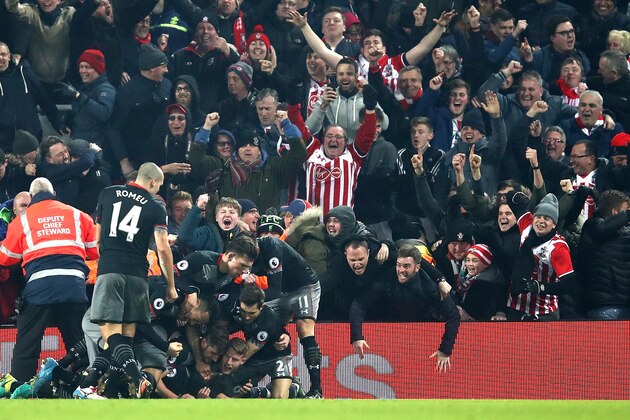 LIVERPOOL, ENGLAND - JANUARY 25:  Shane Long of Southampton (not pictured) celebrates with team mates after scoring his sides first goal during the EFL Cup Semi-Final Second Leg match between Liverpool and Southampton at Anfield on January 25, 2017 in Liverpool, England.  (Photo by Julian Finney/Getty Images)
