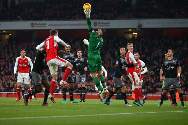 LONDON, ENGLAND - NOVEMBER 30: Southampton goalkeeper Fraser Forster makes a save during the EFL Quarter Final Cup match between Arsenal and Southampton at Emirates Stadium on November 30, 2016 in London, England. (Photo by Catherine Ivill - AMA/Getty Images)