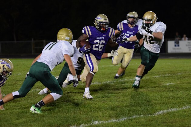 Running back Alphonso Soko [purple jersey, No. 26] has overcome many hurdles to become one of the top players in the state of Iowa for the 2017 cycle.