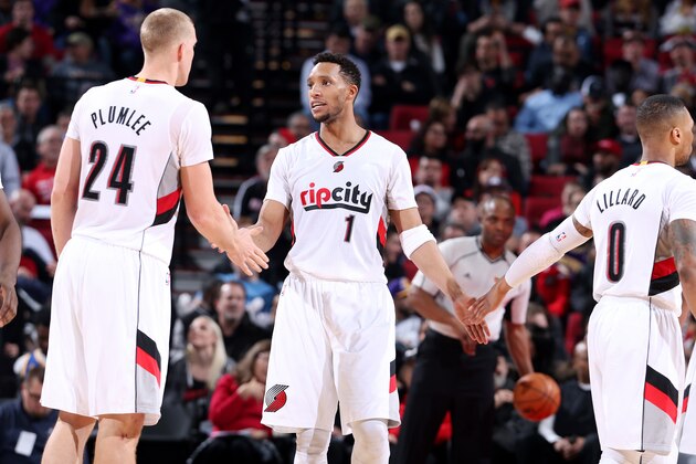 PORTLAND, OR - JANUARY 25: Evan Turner #1 high fives his teammates Mason Plumlee #24 and Damian Lillard #0 of the Portland Trail Blazers during the game against the Los Angeles Lakers on January 25, 2017 at the Moda Center in Portland, Oregon. NOTE TO USER: User expressly acknowledges and agrees that, by downloading and or using this Photograph, user is consenting to the terms and conditions of the Getty Images License Agreement. Mandatory Copyright Notice: Copyright 2017 NBAE (Photo by Sam Forencich/NBAE via Getty Images)