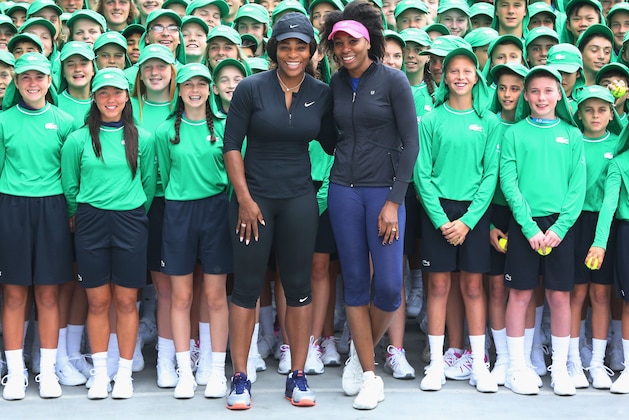 MELBOURNE, AUSTRALIA - JANUARY 10:  Serena Williams (L) and sister Venus Williams of the USA pose with over 380 Australian Open ballkids for the annual welcome ceremony during a practice session ahead of the 2017 Australian Open at Melbourne Park on January 10, 2017 in Melbourne, Australia.  (Photo by Michael Dodge/Getty Images)