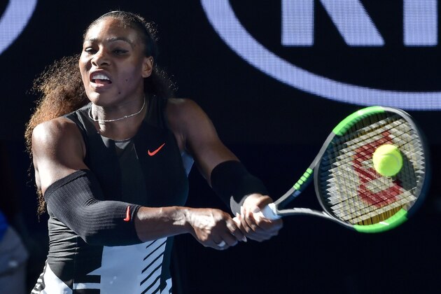 Serena Williams of the US hits a return against Croatia's Mirjana Lucic-Baroni during their women's singles semi-final match on day 11 of the Australian Open tennis tournament in Melbourne on January 26, 2017. / AFP / PAUL CROCK / IMAGE RESTRICTED TO EDITORIAL USE - STRICTLY NO COMMERCIAL USE        (Photo credit should read PAUL CROCK/AFP/Getty Images)