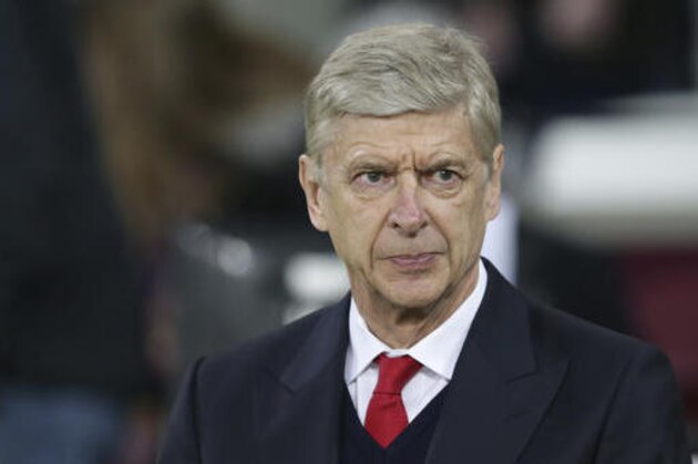 Arsenal Manager Arsene Wenger looks out during the English Premier League soccer match between West Ham United and Arsenal at The London Stadium in London, Saturday Dec. 3, 2016. (AP Photo/Tim Ireland)