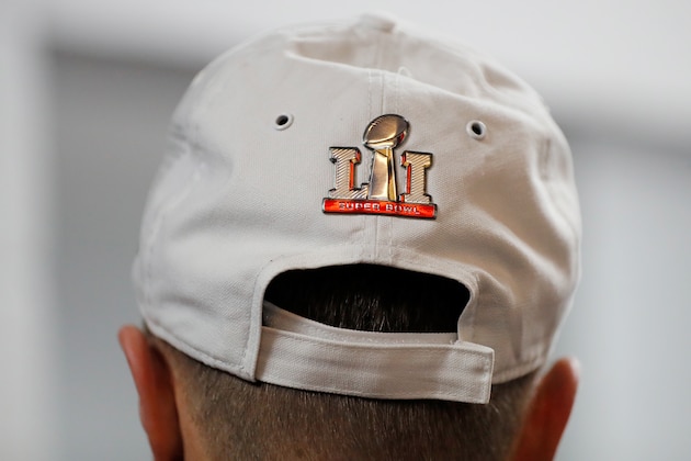 ATLANTA, GA - JANUARY 22: Matt Ryan #2 of the Atlanta Falcons wears a Super Bowl LI hat in the locker room after defeating the Green Bay Packers in the NFC Championship Game at the Georgia Dome on January 22, 2017 in Atlanta, Georgia. The Falcons defeated the Packers 44-21. (Photo by Kevin C. Cox/Getty Images)