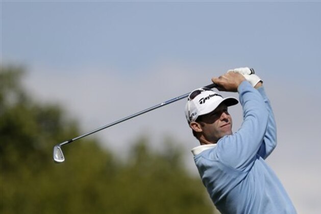 Bradley Dredge from Wales tees off during the golf Czech Masters European Tour Event in Vysoky Ujezd, Czech Republic, Sunday, Aug. 24, 2014. (AP Photo/Petr David Josek)
