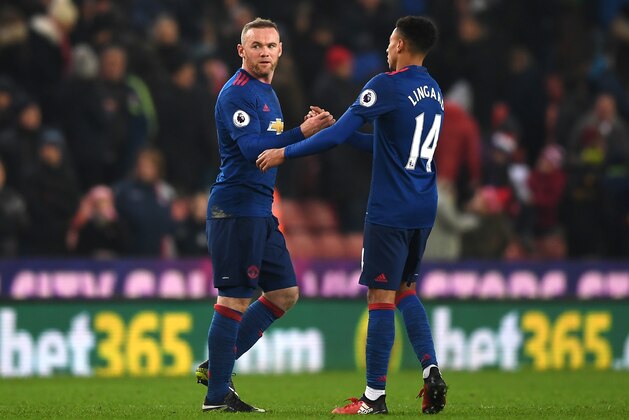 STOKE ON TRENT, ENGLAND - JANUARY 21: Wayne Rooney of Manchester United (L) and Jesse Lingard of Manchester United (R) shake hands during the Premier League match between Stoke City and Manchester United at Bet365 Stadium on January 21, 2017 in Stoke on Trent, England.  (Photo by Gareth Copley/Getty Images)