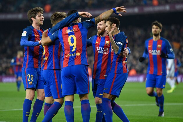 Barcelona's midfielder Denis Suarez (9) celebrates with teammates after scoring the opener during the Spanish Copa del Rey (King's Cup) quarter final second leg football match FC Barcelona vs Real Sociedad at the Camp Nou stadium in Barcelona on January 26, 2017. / AFP / LLUIS GENE (Photo credit should read LLUIS GENE/AFP/Getty Images) Barcelona's midfielder Denis Suarez (9) celebrates with teammates after scoring the opener during the Spanish Copa del Rey (King's Cup) quarter final second leg football match FC Barcelona vs Real Sociedad at the Camp Nou stadium in Barcelona on January 26, 2017. / AFP / LLUIS GENE (Photo credit should read LLUIS GENE/AFP/Getty Images)