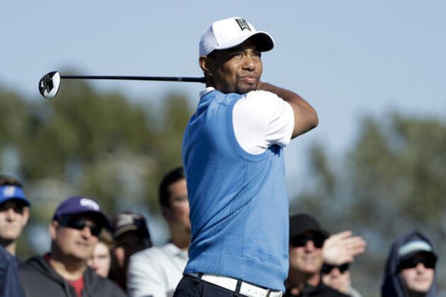 Tiger Woods watches his tee shot on the second hole of the south course during the first round of the Farmers Insurance Open golf tournament Thursday, Jan. 26, 2017, in San Diego. (AP Photo/Gregory Bull)