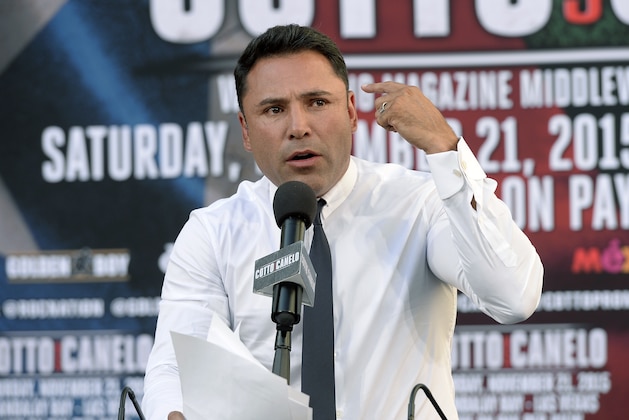 LOS ANGELES, CA - AUGUST 24: Oscar De La Hoya (C), Chairman and CEO, Golden Boy Promotions, speaks during a news conference to announce the WBC middleweight title bout between current champion Miguel Cotto and contender Canelo Alvarez, former WBC and WBA Super Welterweight World Champion, August 24, 2015, in Los Angeles, California. The WBC middleweight title bout will take place November 21 at the Mandalay Bay Events Center in Las Vegas, Nevada. (Photo by Kevork Djansezian/Getty Images) LOS ANGELES, CA - AUGUST 24: Oscar De La Hoya (C), Chairman and CEO, Golden Boy Promotions, speaks during a news conference to announce the WBC middleweight title bout between current champion Miguel Cotto and contender Canelo Alvarez, former WBC and WBA Super Welterweight World Champion, August 24, 2015, in Los Angeles, California. The WBC middleweight title bout will take place November 21 at the Mandalay Bay Events Center in Las Vegas, Nevada. (Photo by Kevork Djansezian/Getty Images)