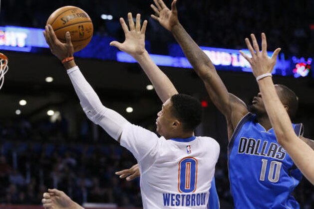 Oklahoma City Thunder guard Russell Westbrook (0) shoots in front of Dallas Mavericks forward Dorian Finney-Smith (10) during the third quarter of an NBA basketball game in Oklahoma City, Thursday, Jan. 26, 2017. Oklahoma City won 109-98. (AP Photo/Sue Ogrocki)