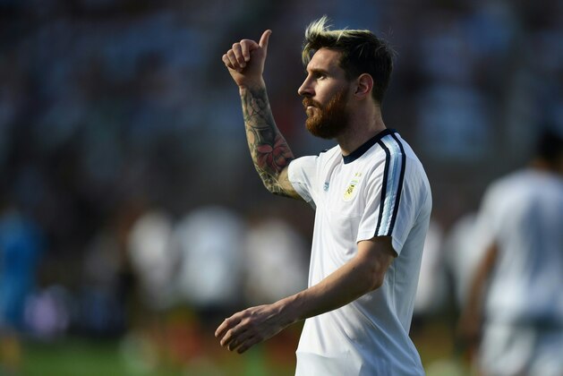Argentina's Lionel Messi warms up before their 2018 FIFA World Cup qualifier football match against Colombia in San Juan, Argentina, on November 15, 2016. / AFP / EITAN ABRAMOVICH        (Photo credit should read EITAN ABRAMOVICH/AFP/Getty Images)