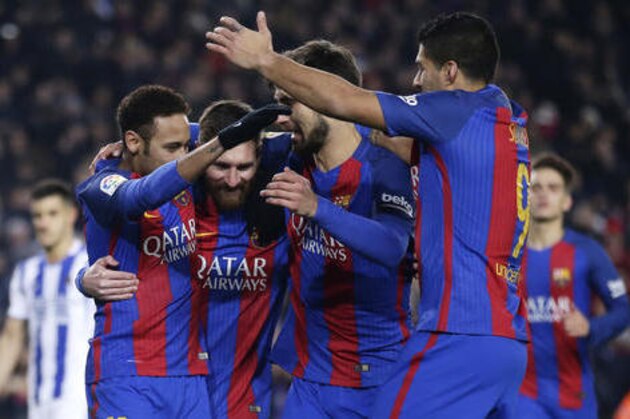 FC Barcelona's Lionel Messi, second left, celebrates with team mates after scoring a penalty during Copa del Rey, quarter final, second leg, soccer match between FC Barcelona and Real Sociedad at the Camp Nou in Barcelona, Spain, Thursday, Jan. 26, 2017. (AP Photo/Manu Fernandez)