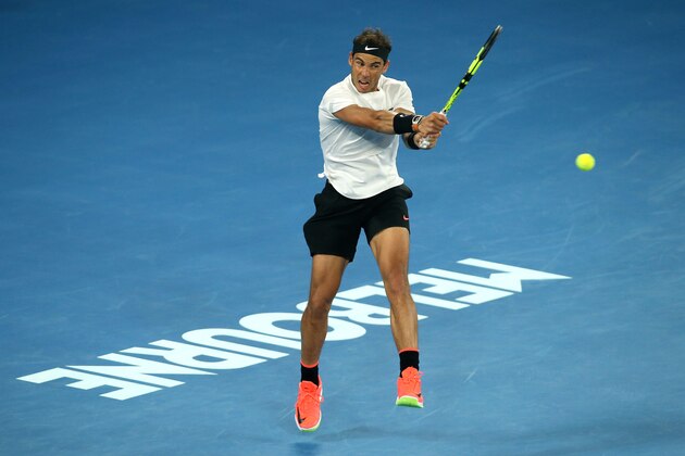MELBOURNE, AUSTRALIA - JANUARY 27:  Rafael Nadal of Spain plays a backhand in his semifinal match against Grigor Dimitrov of Bulgaria on day 12 of the 2017 Australian Open at Melbourne Park on January 27, 2017 in Melbourne, Australia.  (Photo by Pat Scala/Getty Images)