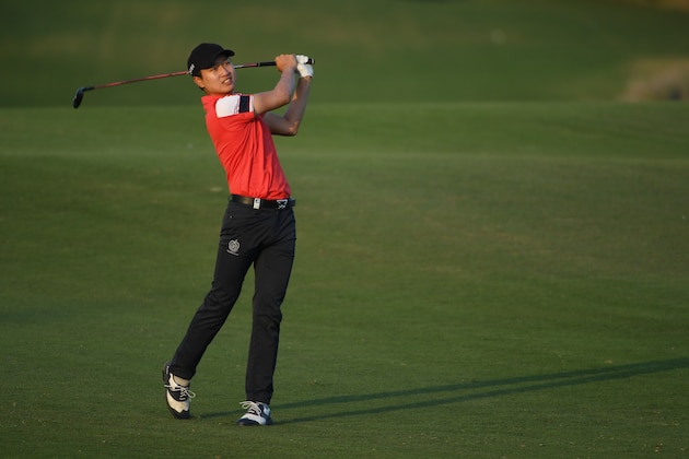 DOHA, QATAR - JANUARY 27:  Jeunghun Wang of South Korea plays his second shot on the 18th hole during the second round of the Commercial Bank Qatar Masters at the Doha Golf Club on January 27, 2017 in Doha, Qatar.  (Photo by Ross Kinnaird/Getty Images)