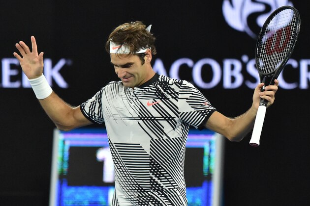 Switzerland's Roger Federer celebrates his victory against Switzerland's Stanislas Wawrinka during their men's singles semi-final match on day 11 of the Australian Open tennis tournament in Melbourne on January 26, 2017. / AFP / PETER PARKS / IMAGE RESTRICTED TO EDITORIAL USE - STRICTLY NO COMMERCIAL USE        (Photo credit should read PETER PARKS/AFP/Getty Images)