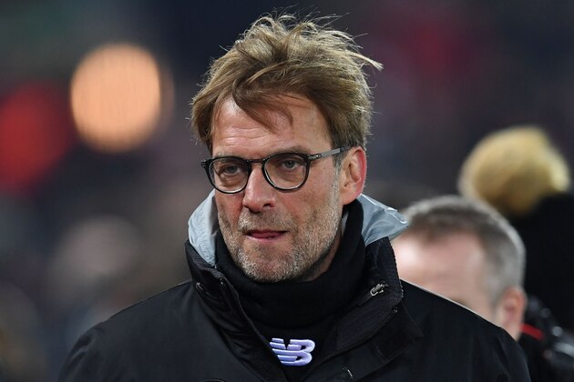 Liverpool's German manager Jurgen Klopp arrives on the pitch ahead of the EFL (English Football League) Cup semi-final second-leg football match between Liverpool and Southampton at Anfield in Liverpool, north west England on January 25, 2017. / AFP / Paul ELLIS / RESTRICTED TO EDITORIAL USE. No use with unauthorized audio, video, data, fixture lists, club/league logos or 'live' services. Online in-match use limited to 75 images, no video emulation. No use in betting, games or single club/league/player publications.  /         (Photo credit should read PAUL ELLIS/AFP/Getty Images)