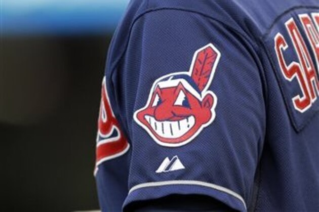 In this April 8, 2014 photo, the Cleveland Indians Chief Wahoo logo is shown on the uniform sleeve of third base coach Mike Sarbaugh during a baseball game against the San Diego Padres in Cleveland. Ohio state senator Eric Kearney says it's time for the Indians to drop their offensive name and Chief Wahoo mascot. Kearney, a Democrat from Cincinnati, introduced a resolution that if passed by the Legislature would encourage the baseball team to adopt a new name and mascot. (AP Photo/Mark Duncan)