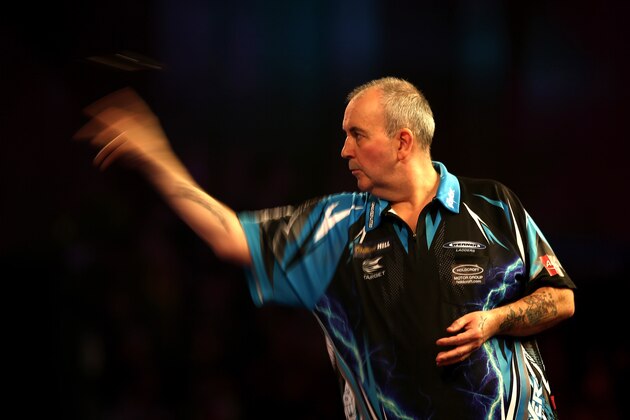 LONDON, ENGLAND - DECEMBER 18:  Phil Taylor of England throws during his first round match against David Platt of England  during Day Four of the 2017 William Hill PDC World Darts Championships  at Alexandra Palace on December 18, 2016 in London, England.  (Photo by Alex Pantling/Getty Images)