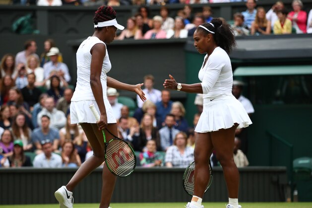 LONDON, ENGLAND - JULY 09:  Serena Williams of The United States (R) and Venus Williams of The United States (L) in conversation during the Ladies Doubles Final against Timea Babos of hungary and Yaroslava Shvedova of Kazakhstan on day twelve of the Wimbledon Lawn Tennis Championships at the All England Lawn Tennis and Croquet Club on July 9, 2016 in London, England.  (Photo by Clive Brunskill/Getty Images)