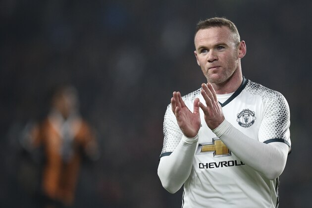 Manchester United's English striker Wayne Rooney claps after winning the EFL (English Football League) Cup semi-final second-leg football match between Hull City and Manchester United at the KCOM Stadium in Kingston upon Hull, north east England on January 26, 2017.
  / AFP / Oli SCARFF / RESTRICTED TO EDITORIAL USE. No use with unauthorized audio, video, data, fixture lists, club/league logos or 'live' services. Online in-match use limited to 75 images, no video emulation. No use in betting, games or single club/league/player publications.  /         (Photo credit should read OLI SCARFF/AFP/Getty Images)