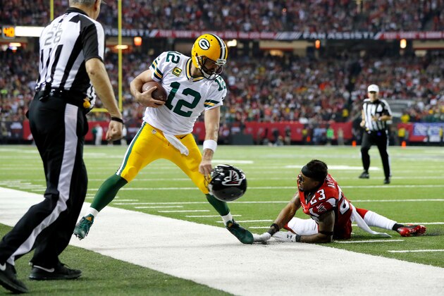 ATLANTA, GA - JANUARY 22:  Robert Alford #23 of the Atlanta Falcons attempts to tackle Aaron Rodgers #12 of the Green Bay Packers in the fourth quarter in the NFC Championship Game at the Georgia Dome on January 22, 2017 in Atlanta, Georgia.  (Photo by Kevin C. Cox/Getty Images)