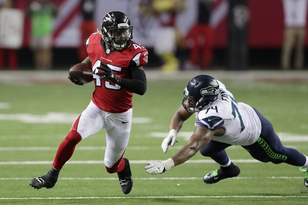 ATLANTA, GA - JANUARY 14:  Deion Jones #45 of the Atlanta Falcons runs the ball agaisnt the Seattle Seahawks at the Georgia Dome on January 14, 2017 in Atlanta, Georgia.  (Photo by Streeter Lecka/Getty Images)
