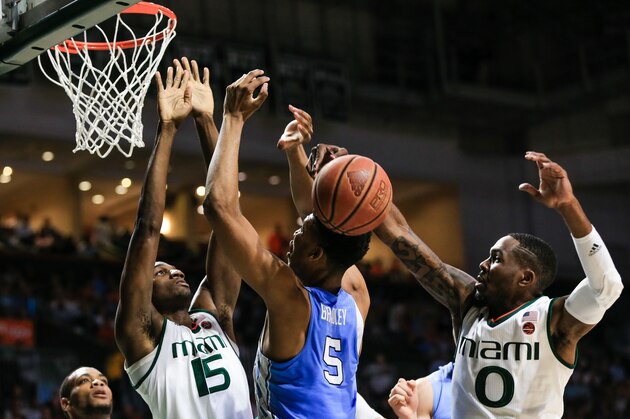 MIAMI, FL - JANUARY 28: Tony Bradley #5 of the North Carolina Tar Heels has a shot blocked by Ja'Quan Newton #0 of the Miami Hurricanes during the first half of the game at the Watsco Center on January 28, 2017 in Miami, Florida. (Photo by Rob Foldy/Getty Images)