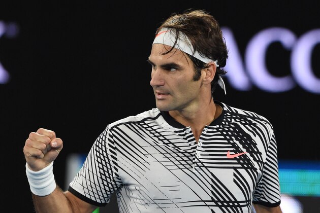 Switzerland's Roger Federer reacts after a point against Spain's Rafael Nadal during their men's singles final match on day 14 of the Australian Open tennis tournament in Melbourne on January 29, 2017. / AFP / PAUL CROCK / IMAGE RESTRICTED TO EDITORIAL USE - STRICTLY NO COMMERCIAL USE        (Photo credit should read PAUL CROCK/AFP/Getty Images)