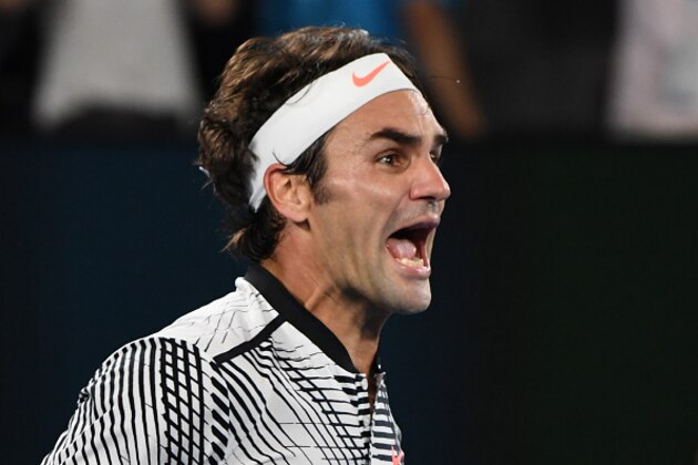 Switzerland's Roger Federer celebrates his victory against Spain's Rafael Nadal during the men's singles final on day 14 of the Australian Open tennis tournament in Melbourne on January 29, 2017. / AFP / GREG WOOD / IMAGE RESTRICTED TO EDITORIAL USE - STRICTLY NO COMMERCIAL USE        (Photo credit should read GREG WOOD/AFP/Getty Images)