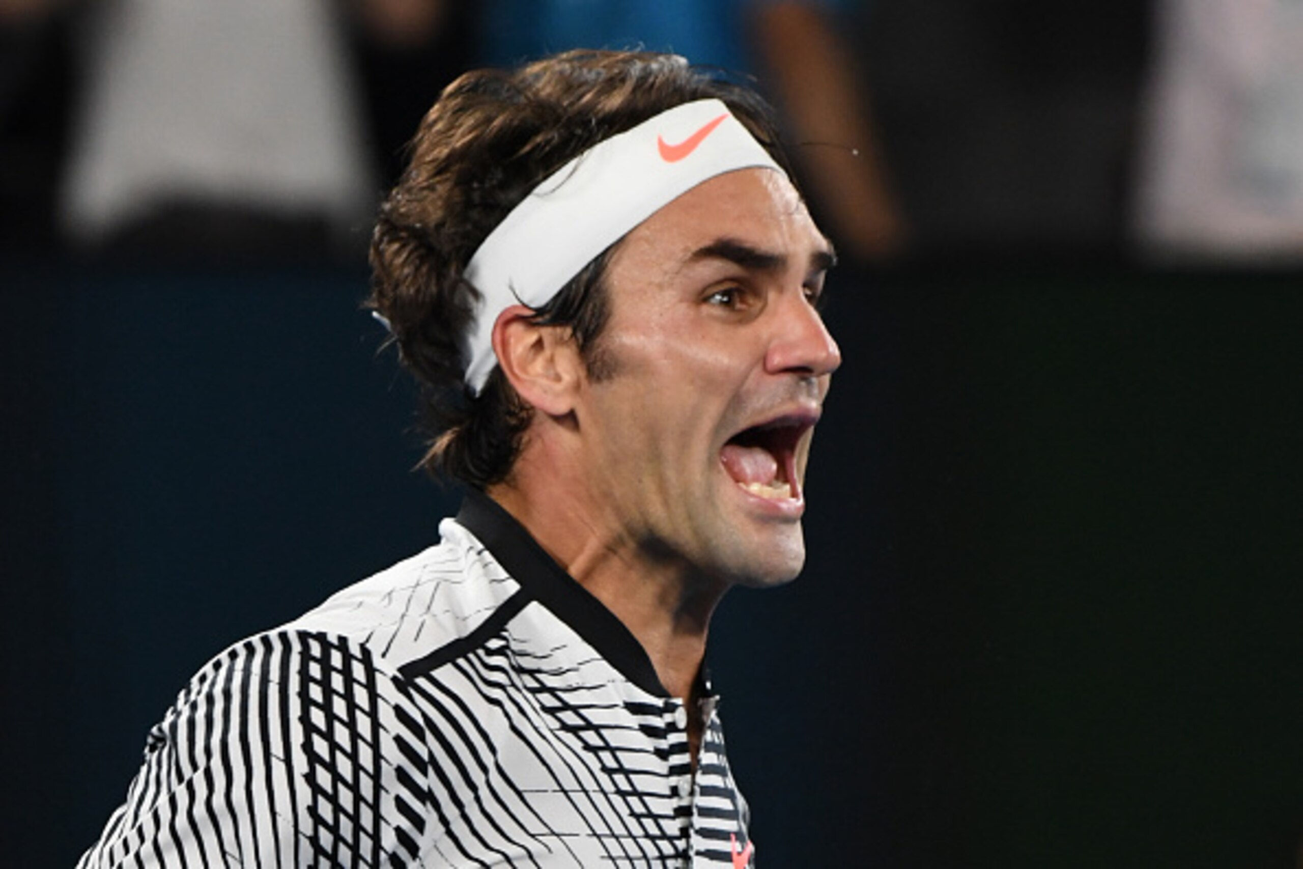 Switzerland's Roger Federer celebrates his victory against Spain's Rafael Nadal during the men's singles final on day 14 of the Australian Open tennis tournament in Melbourne on January 29, 2017. / AFP / GREG WOOD / IMAGE RESTRICTED TO EDITORIAL USE - STRICTLY NO COMMERCIAL USE        (Photo credit should read GREG WOOD/AFP/Getty Images)