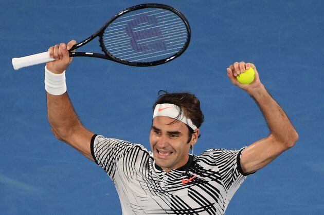 Roger Federer of Switzerland celebrates his victory over Rafael Nadal of Spain in the men's singles final on day 14 of the Australian Open tennis tournament in Melbourne on January 29, 2017. / AFP / SAEED KHAN / IMAGE RESTRICTED TO EDITORIAL USE - STRICTLY NO COMMERCIAL USE        (Photo credit should read SAEED KHAN/AFP/Getty Images)