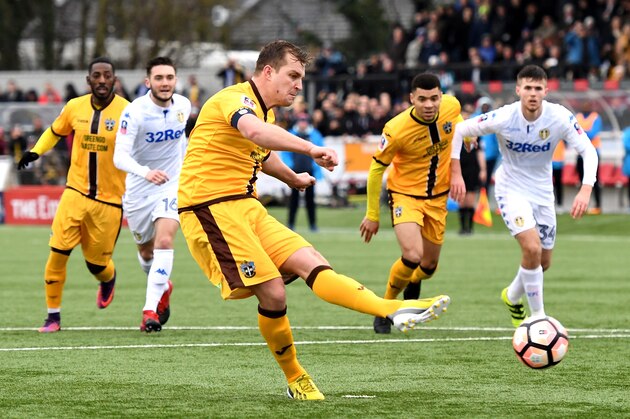 SUTTON, GREATER LONDON - JANUARY 29:  Jamie Collins of Sutton United (C) scores his sides first goal from the penalty spot during The Emirates FA Cup Fourth Round match between Sutton United and Leeds United at Borough Sports Ground on January 29, 2017 in Sutton, Greater London.  (Photo by Mike Hewitt/Getty Images)