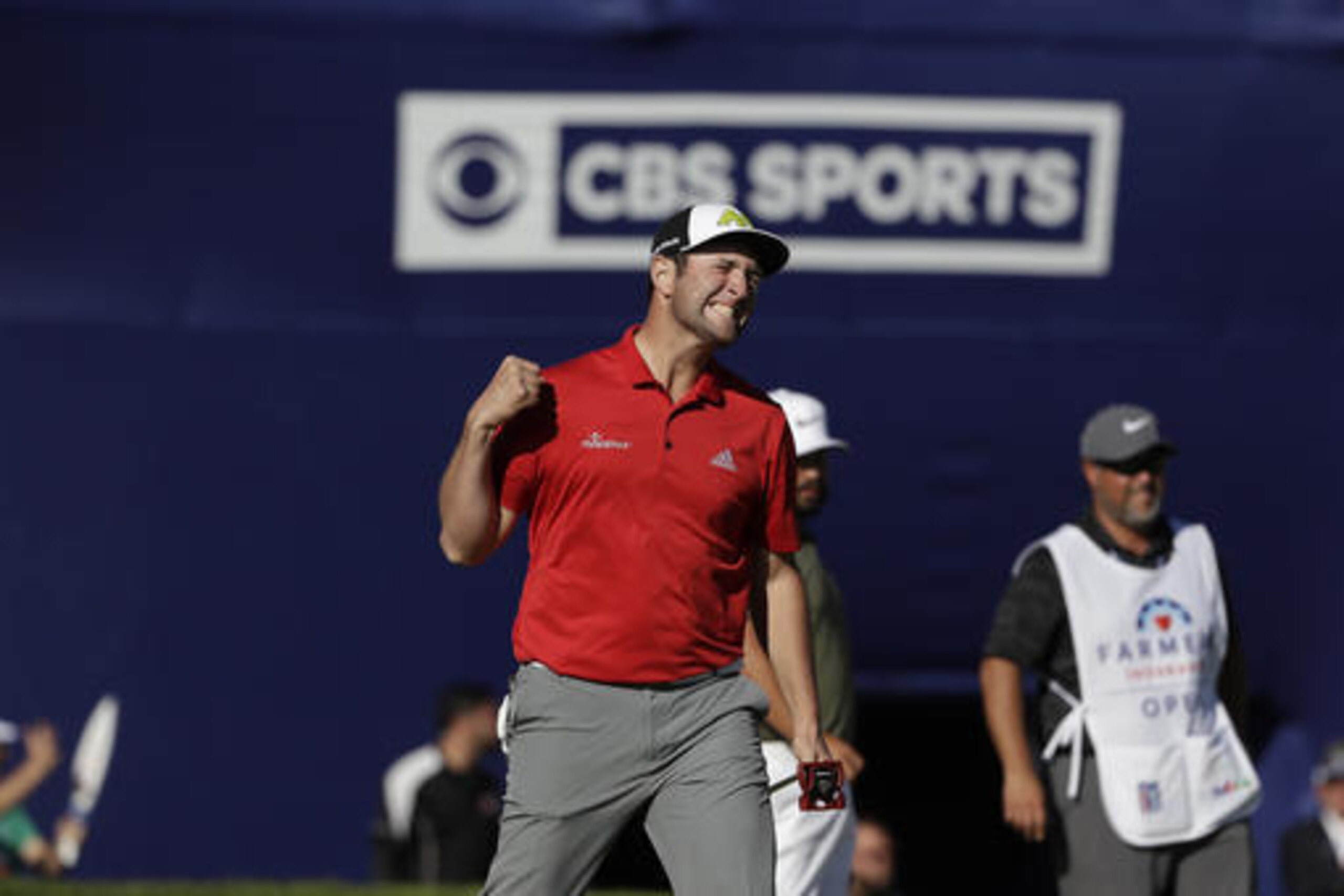 Jon Rahm, of Spain, reacts after making a putt for eagle on the 18th hole of the South Course during the final round of the Farmers Insurance Open golf tournament Sunday, Jan. 29, 2017, at Torrey Pines Golf Course in San Diego. (AP Photo/Gregory Bull)
