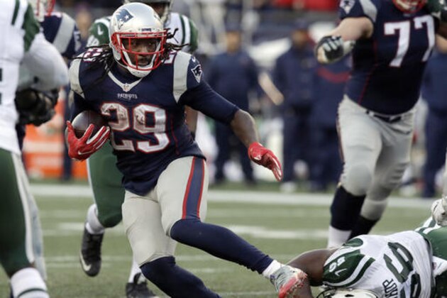 New England Patriots running back LeGarrette Blount (29) runs away from New York Jets linebacker Freddie Bishop (56) during the second half of an NFL football game, Saturday, Dec. 24, 2016, in Foxborough, Mass. (AP Photo/Charles Krupa)