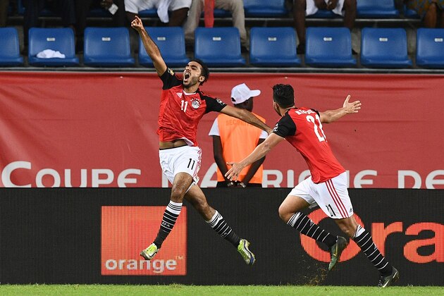 Egypt's midfielder Mahmoud Abdel-Moneim (L) celebrates with Egypt's midfielder Mahmoud Hassan after scoring a goal during the 2017 Africa Cup of Nations quarter-final football match between Egypt and Morocco in Port-Gentil on January 29, 2017. / AFP / Justin TALLIS        (Photo credit should read JUSTIN TALLIS/AFP/Getty Images)