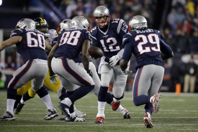 New England Patriots quarterback Tom Brady (12) hands off the ball to running back LeGarrette Blount (29) during the first half of the AFC championship NFL football game against the Pittsburgh Steelers, Sunday, Jan. 22, 2017, in Foxborough, Mass. (AP Photo/Elise Amendola)