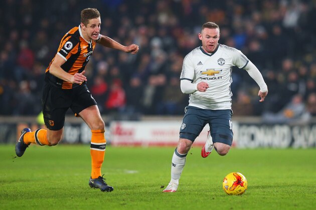 HULL, ENGLAND - JANUARY 26:  Wayne Rooney of Manchester United is chased by Michael Dawson of Hull City during the EFL Cup Semi-Final second leg match between Hull City and Manchester United at KCOM Stadium on January 26, 2017 in Hull, England.  (Photo by Alex Livesey/Getty Images)