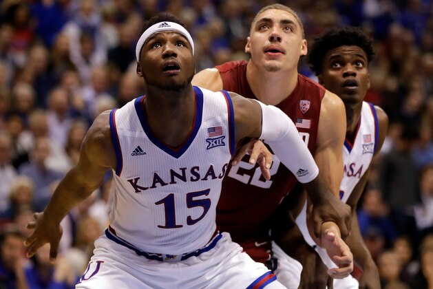 LAWRENCE, KS - DECEMBER 03:  Carlton Bragg Jr. #15, Lagerald Vick #2 of the Kansas Jayhawks, and Reid Travis #22 of the Stanford Cardinal box out during a free throw in the game at Allen Fieldhouse on December 3, 2016 in Lawrence, Kansas.  (Photo by Jamie Squire/Getty Images)