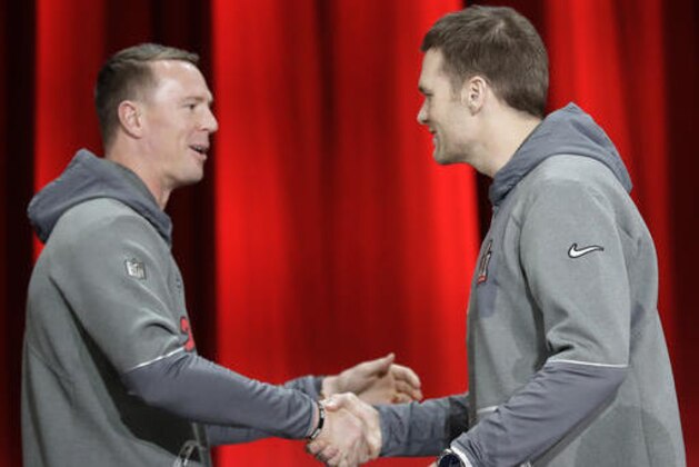 New England Patriots' Tom Brady shakes hands with Atlanta Falcons' Matt Ryan during opening night for the NFL Super Bowl 51 football game at Minute Maid Park Monday, Jan. 30, 2017, in Houston. (AP Photo/David J. Phillip)