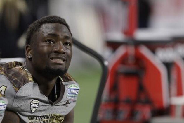 Western Michigan wide receiver Corey Davis sits on the bench during the second half of the Mid-American Conference championship NCAA college football game against Ohio, Friday, Dec. 2, 2016, in Detroit. (AP Photo/Carlos Osorio)