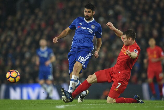 Liverpool's English midfielder James Milner (R) vie with Chelsea's Brazilian-born Spanish striker Diego Costa during the English Premier League football match between Liverpool and Chelsea at Anfield in Liverpool, north west England on January 31, 2017. / AFP / PAUL ELLIS / RESTRICTED TO EDITORIAL USE. No use with unauthorized audio, video, data, fixture lists, club/league logos or 'live' services. Online in-match use limited to 75 images, no video emulation. No use in betting, games or single club/league/player publications.  /         (Photo credit should read PAUL ELLIS/AFP/Getty Images)
